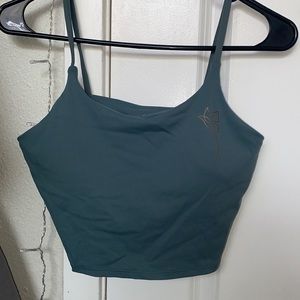 Blue-ish/ green-ish sports shirt